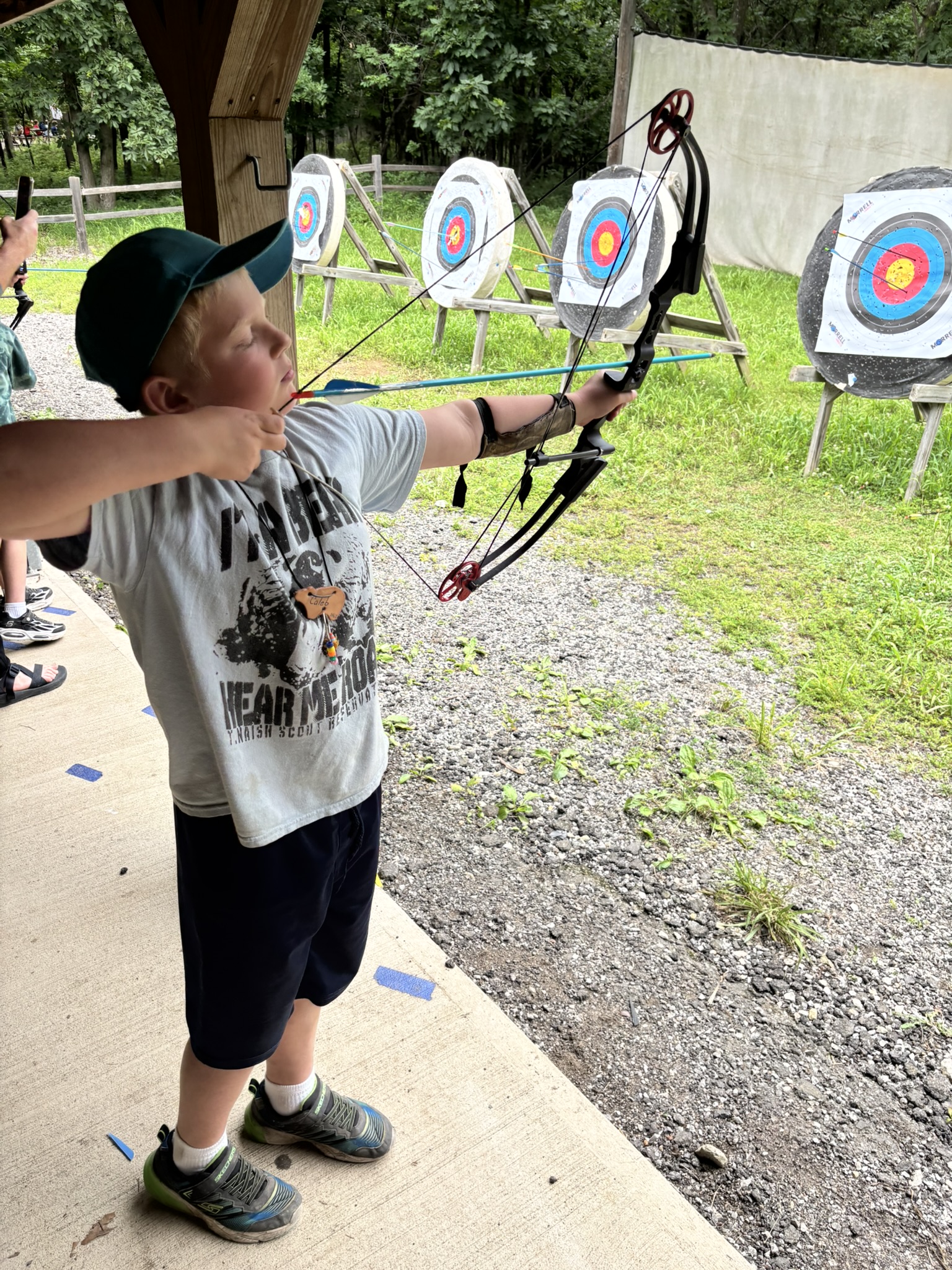 Scout at archery range
