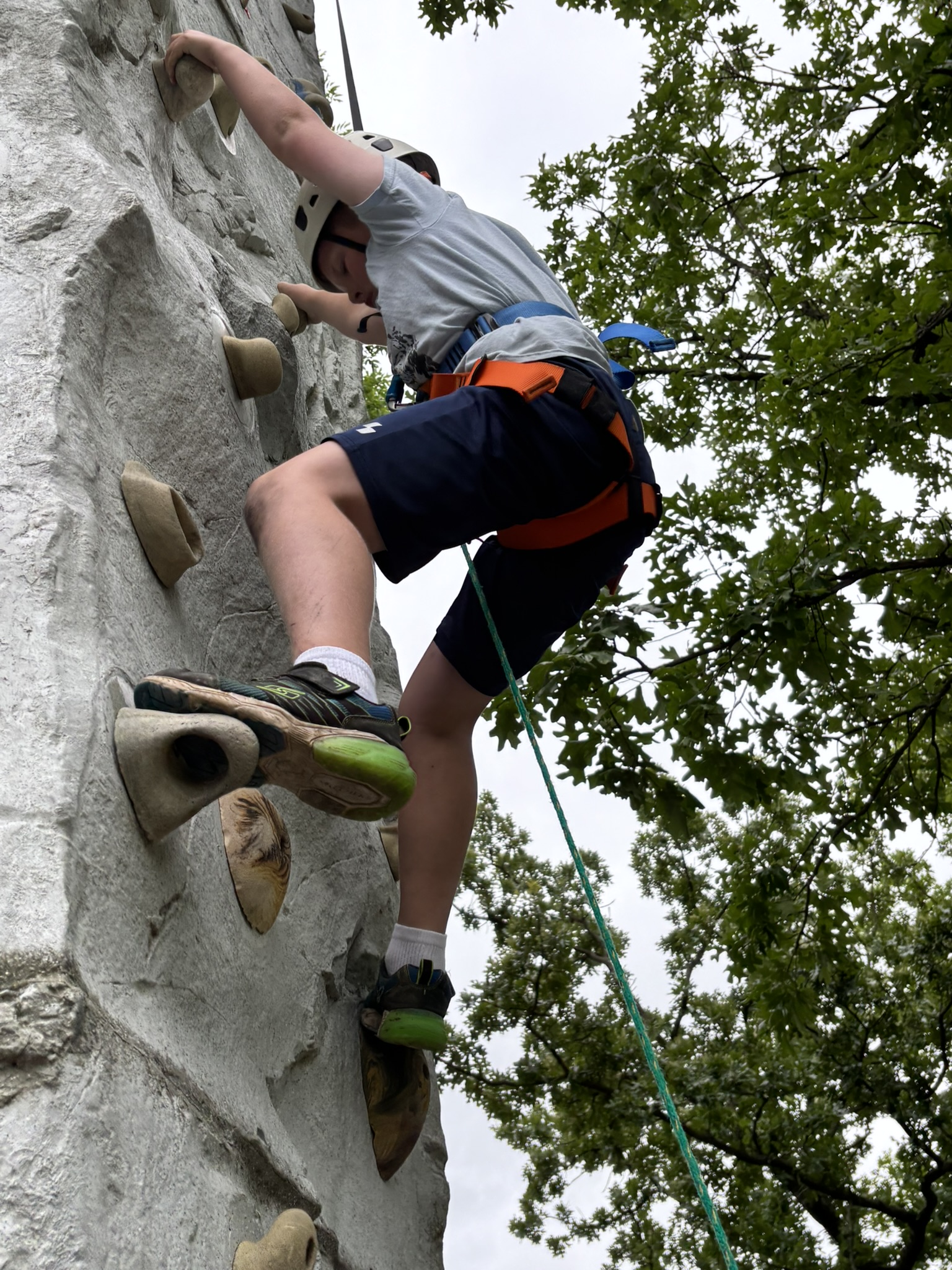 Scout rock climbing at camp